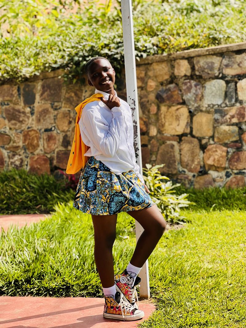 A dancer against a stone wall in the kilt collection.