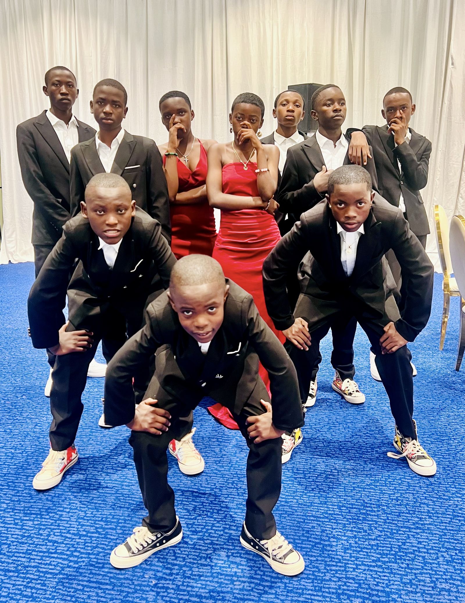 The CCF crew dressed sharp in black suits before a performance.